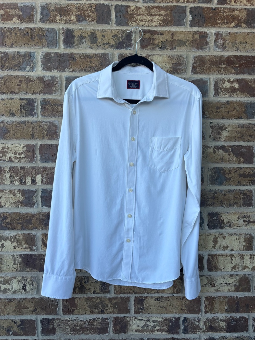 Classic and versatile UNTUCKit men’s button-down shirt in crisp white.